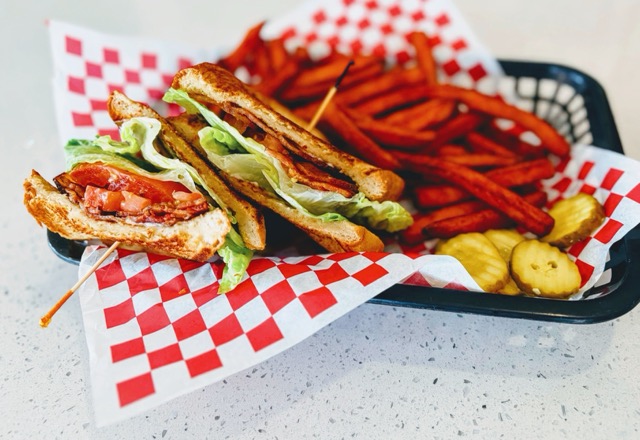Classic BLT sandwich with sweet potato fries and pickles at Joe's Naples Park Diner Naples Florida